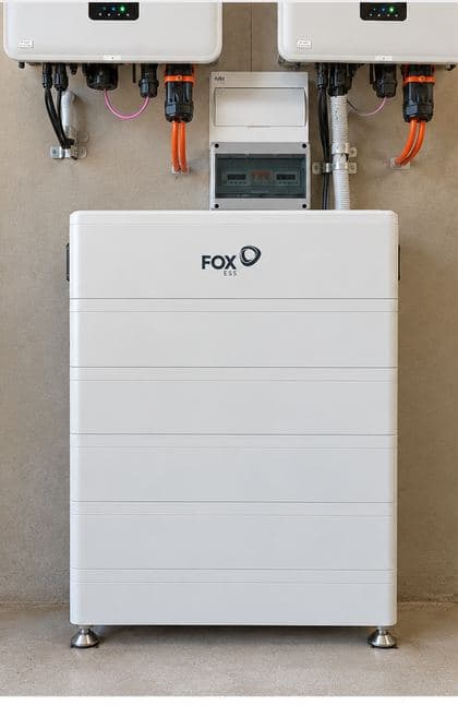 A floor-standing FoxESS battery stack, showing the taller top module and the slimmer modules beneath it.